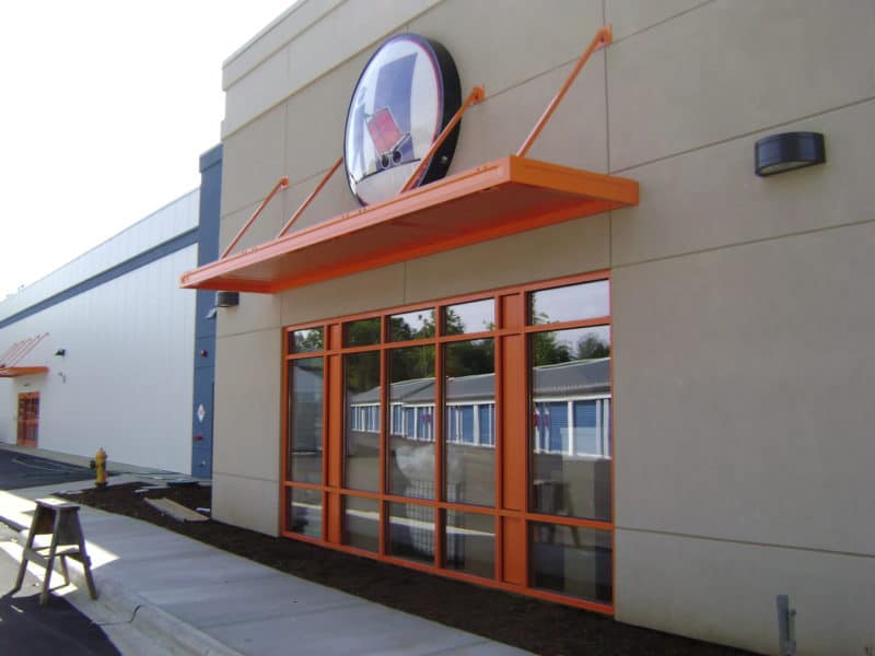 Orange awning over store front windows