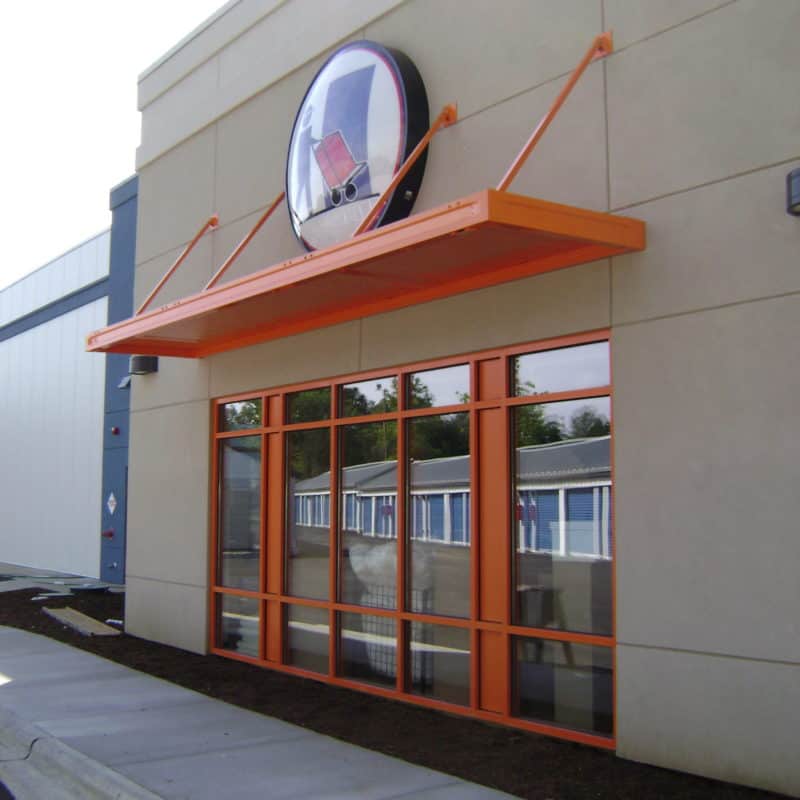 Orange awning over store front windows