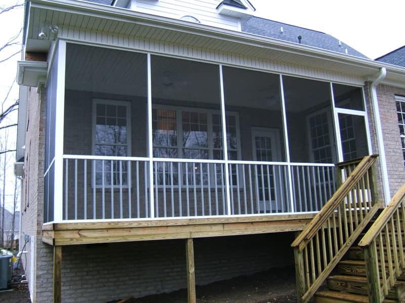 White aluminum residential screened in porch
