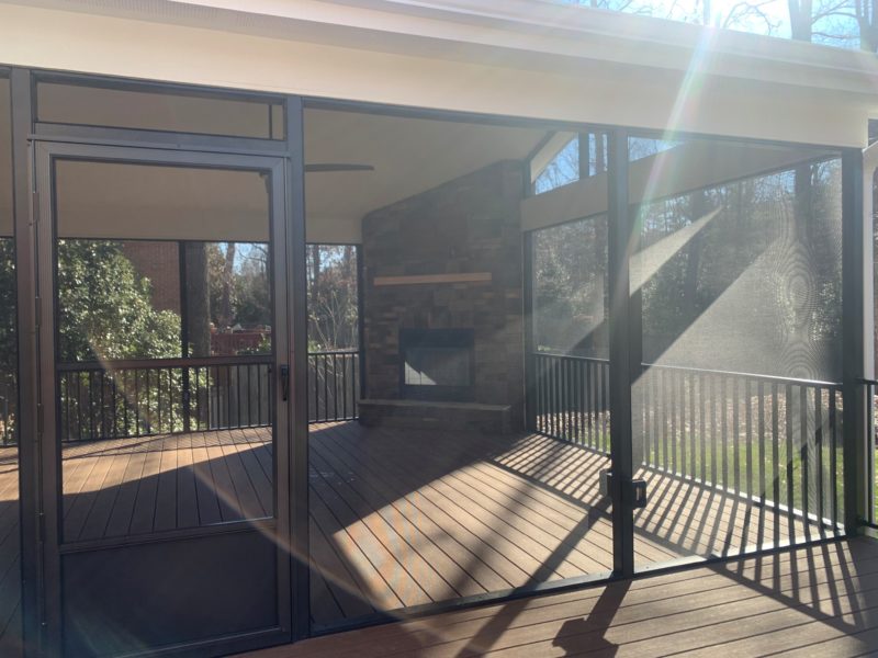 Black and beige aluminum residential screened in porch