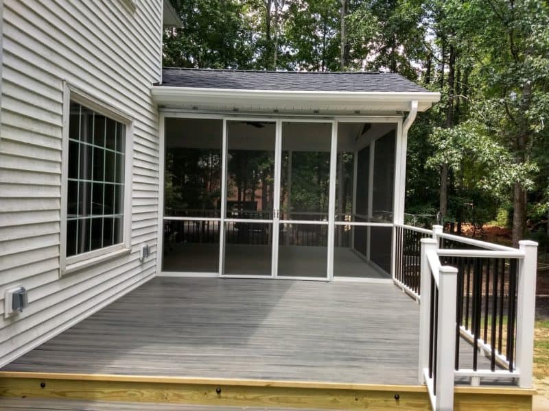 White aluminum residential screened in porch