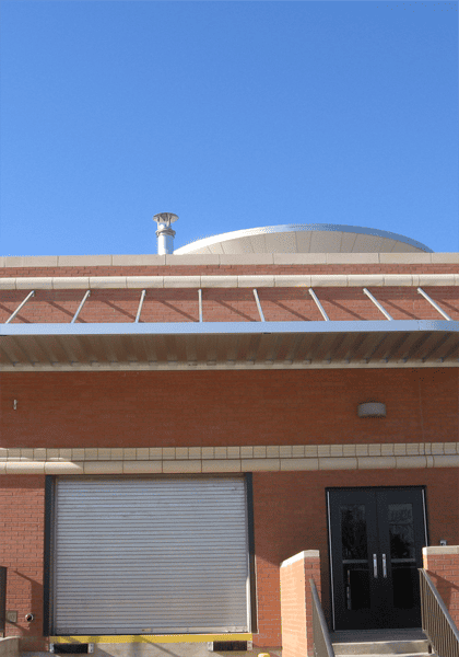 Silver aluminum awning over warehouse entrance