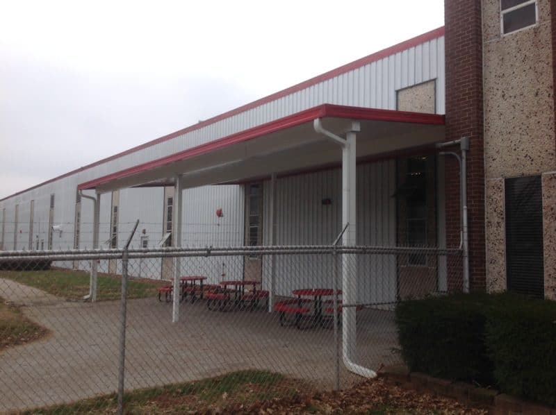 Red awning for back porch of a school